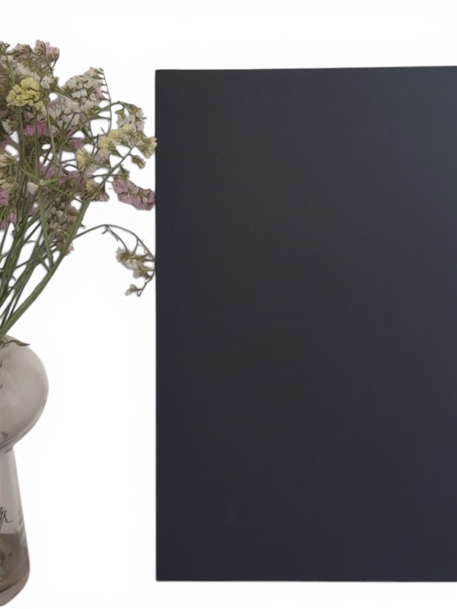 Dark canvas beside soft florals