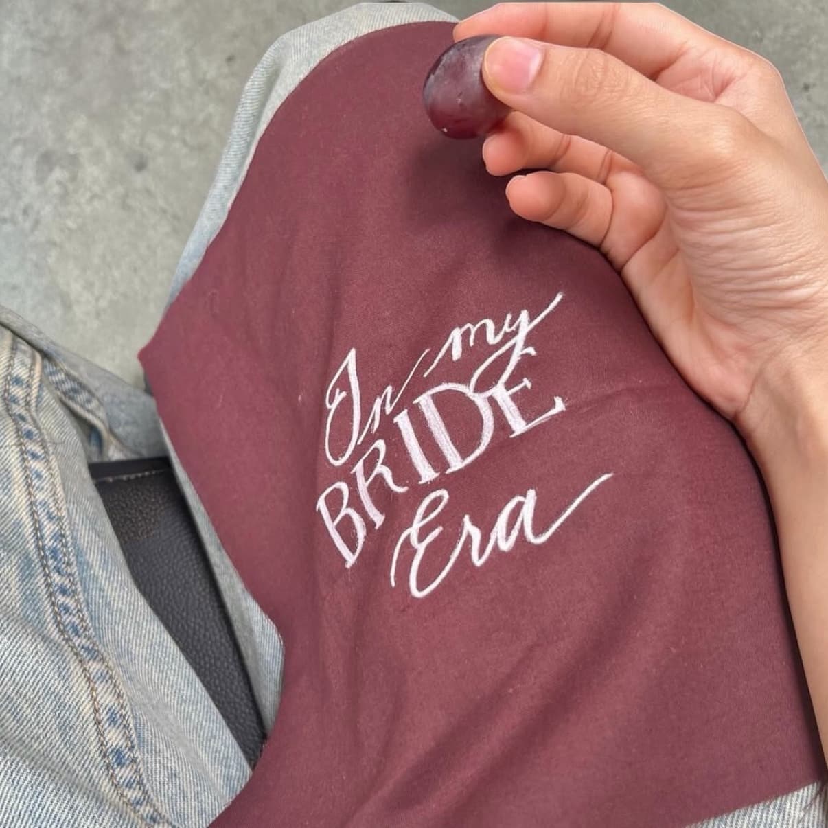 White calligraphy on burgundy linen fabric