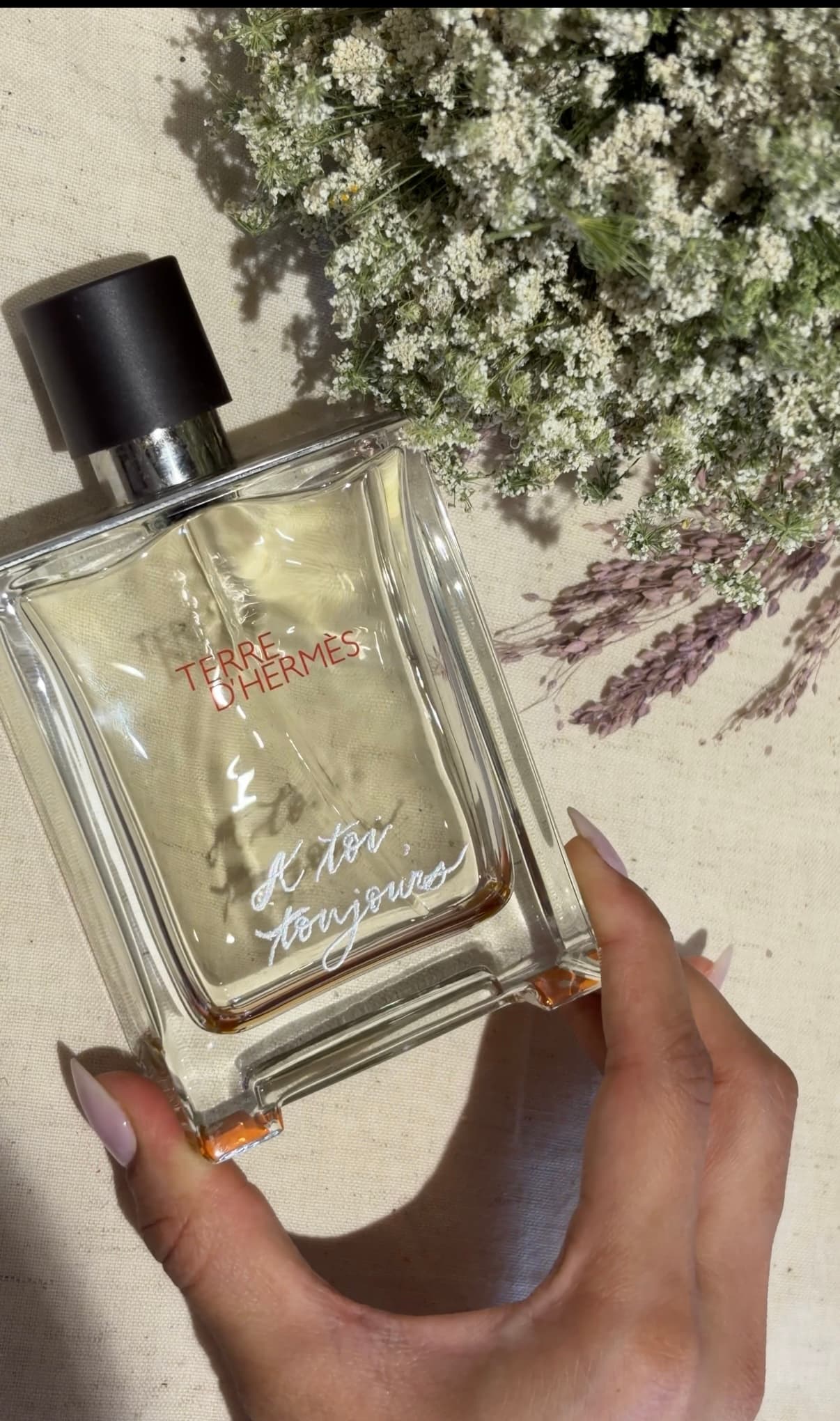 Personalized calligraphy on a glass perfume bottle