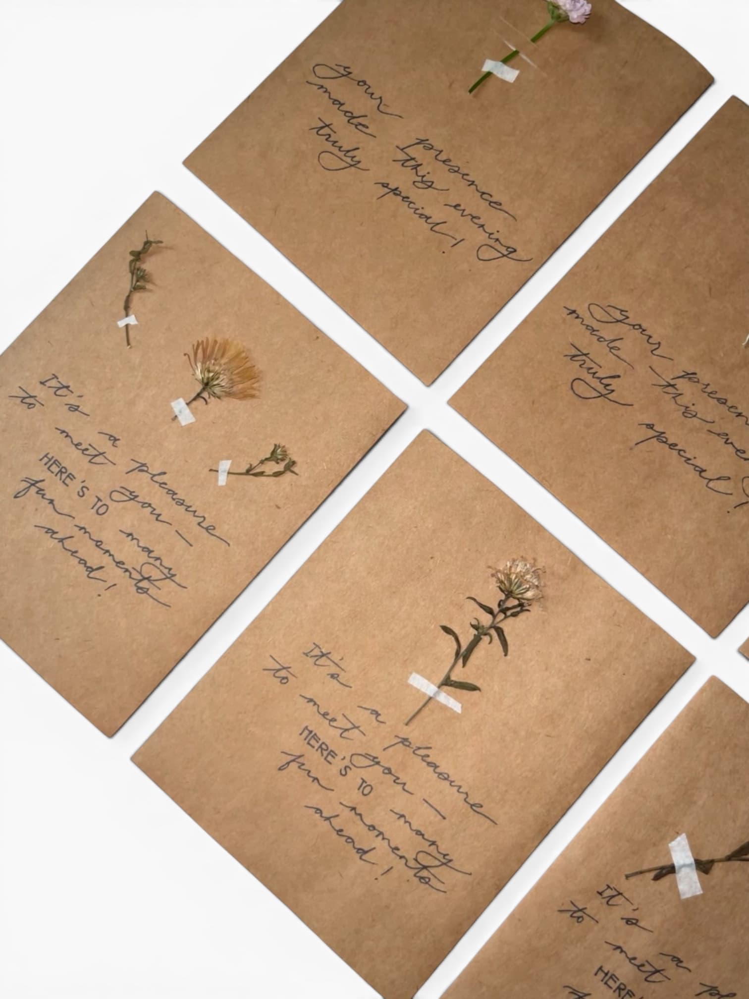 Hand-lettered kraft paper cards with pressed flowers